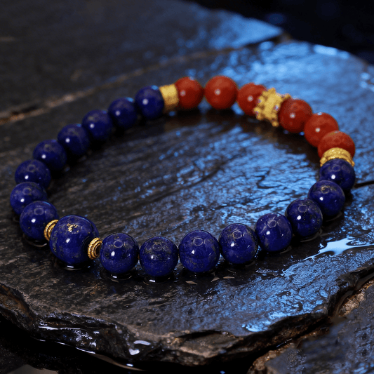 Lapis Lazuli & Red Agate Bracelet I on a damp slate surface, in a dim background
