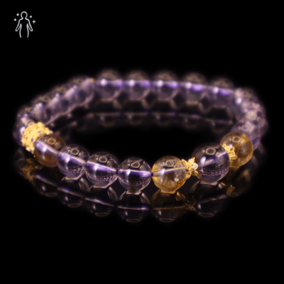 Vivid Pure Amethyst & Tajing Bracelet I with Yellow Tajing and gold-plated silver reflecting on a dark background.