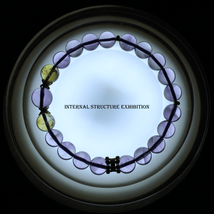 Translucent Pure Amethyst & Tajing Bracelet I backlit to reveal the internal structure of the gemstone beads.