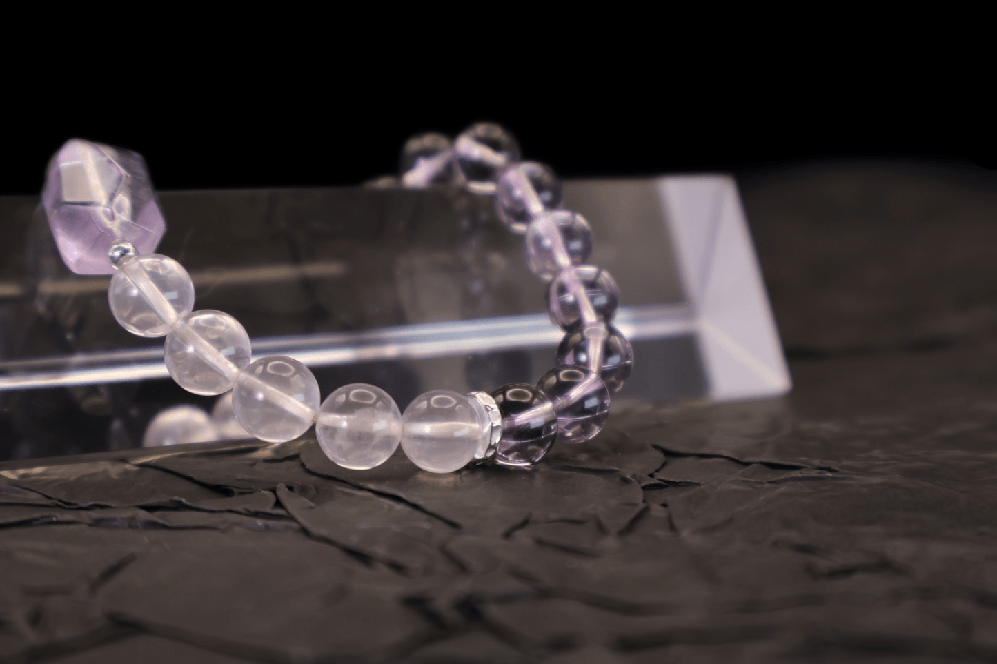 Amethyst & Pink Quartz Bracelet I on a black background