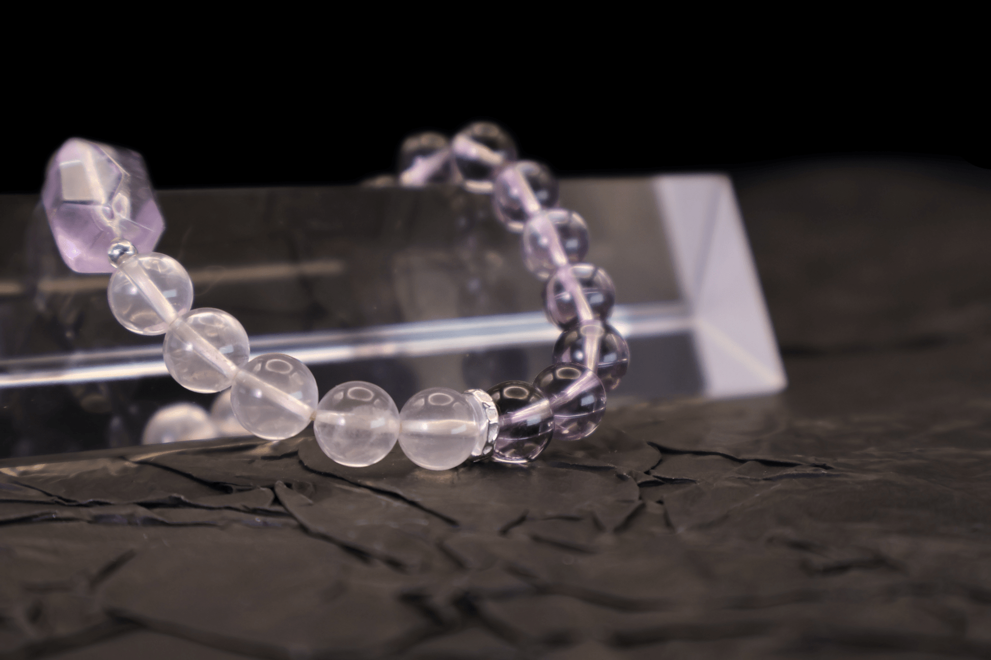 Amethyst & Pink Quartz Bracelet I on a black background