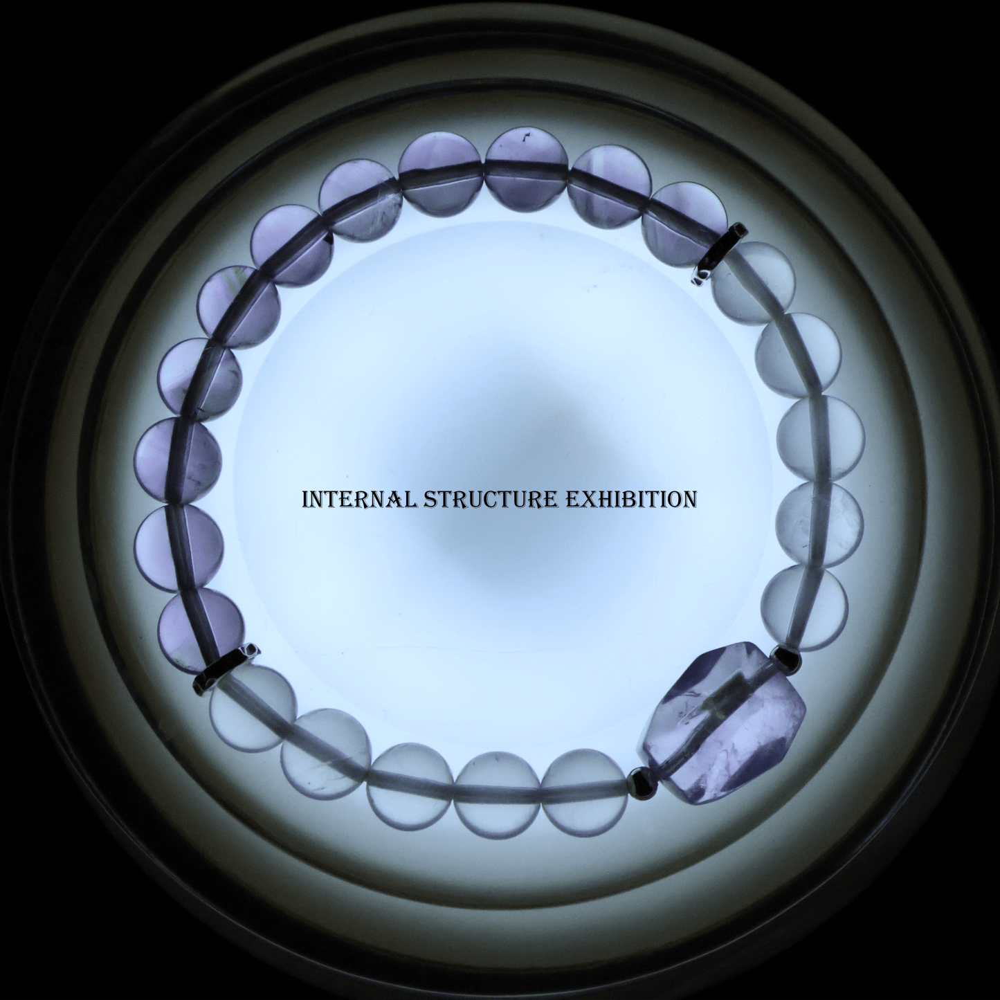 Amethyst & Pink Quartz Bracelet I on a lighting background, which shows its internal structure
