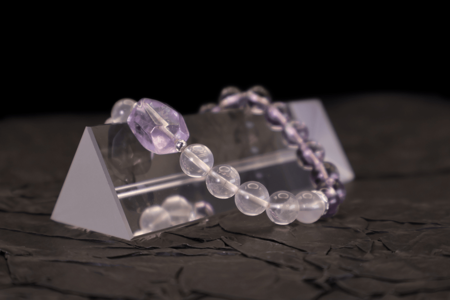 Amethyst & Pink Quartz Bracelet I on a black background