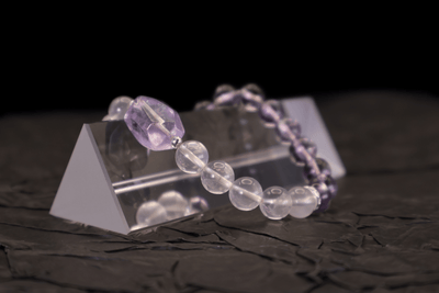 Amethyst & Pink Quartz Bracelet I on a black background