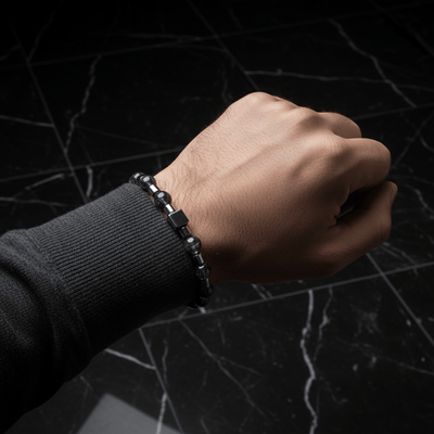 A fashion man richer wears a Black Rutile & Hematite Bracelet I