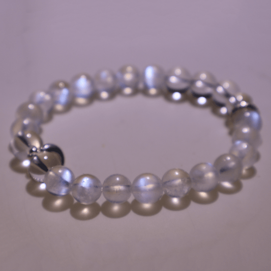 Blue Moonstone & Clear Quartz Bracelet I under natural light showing its blue "moon" light