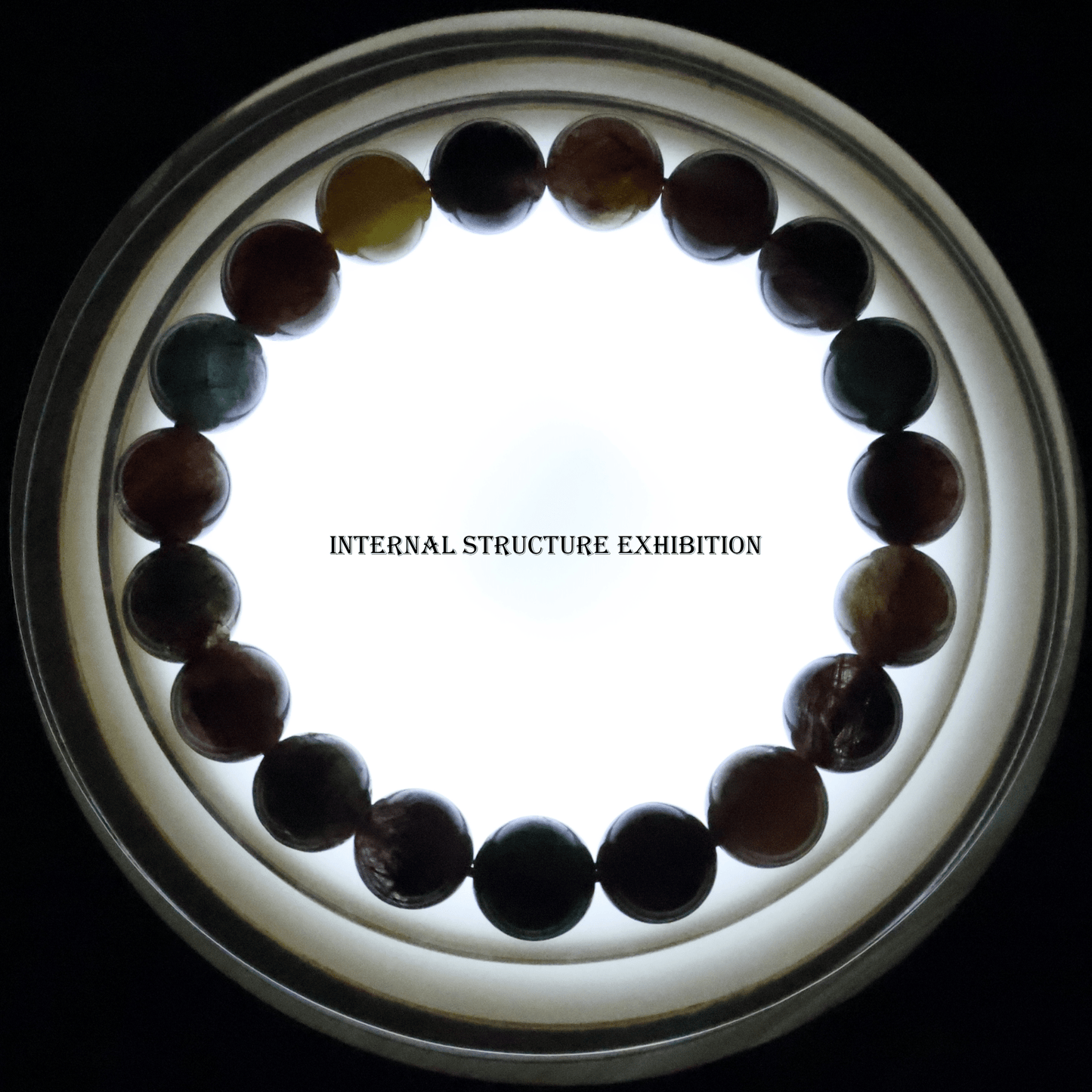 Colours Rutile Quartz Bracelet I on white background, which shows internal structure