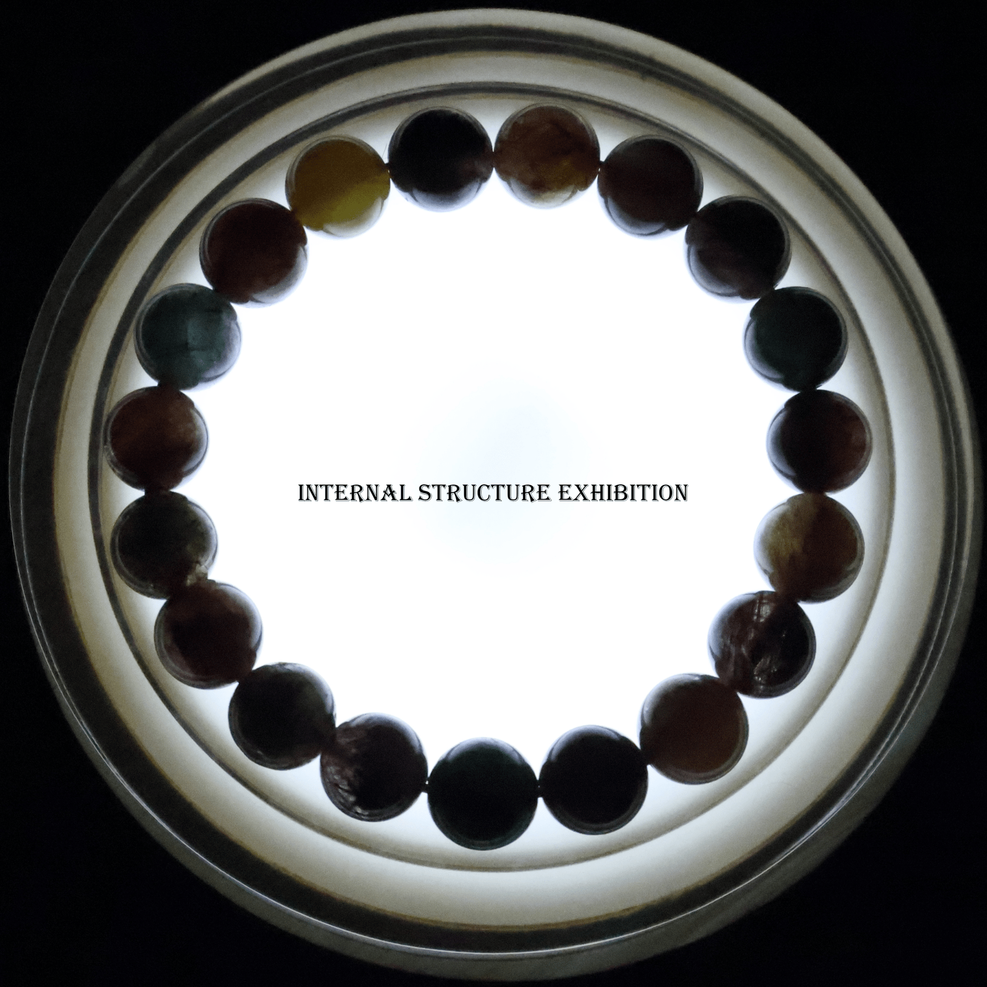 Colours Rutile Quartz Bracelet I on white background, which shows internal structure