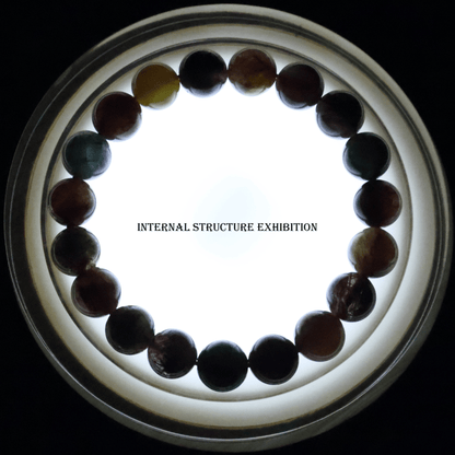 Colours Rutile Quartz Bracelet I on white background, which shows internal structure