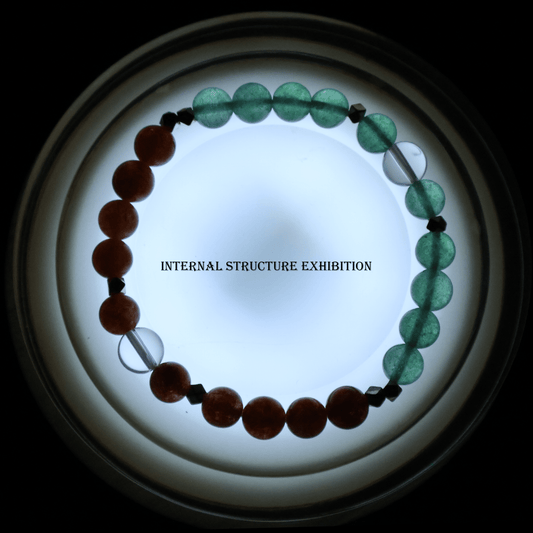 Gold Sunstone & Green Strawberry Bracelet I on white background, which shows its internal structure