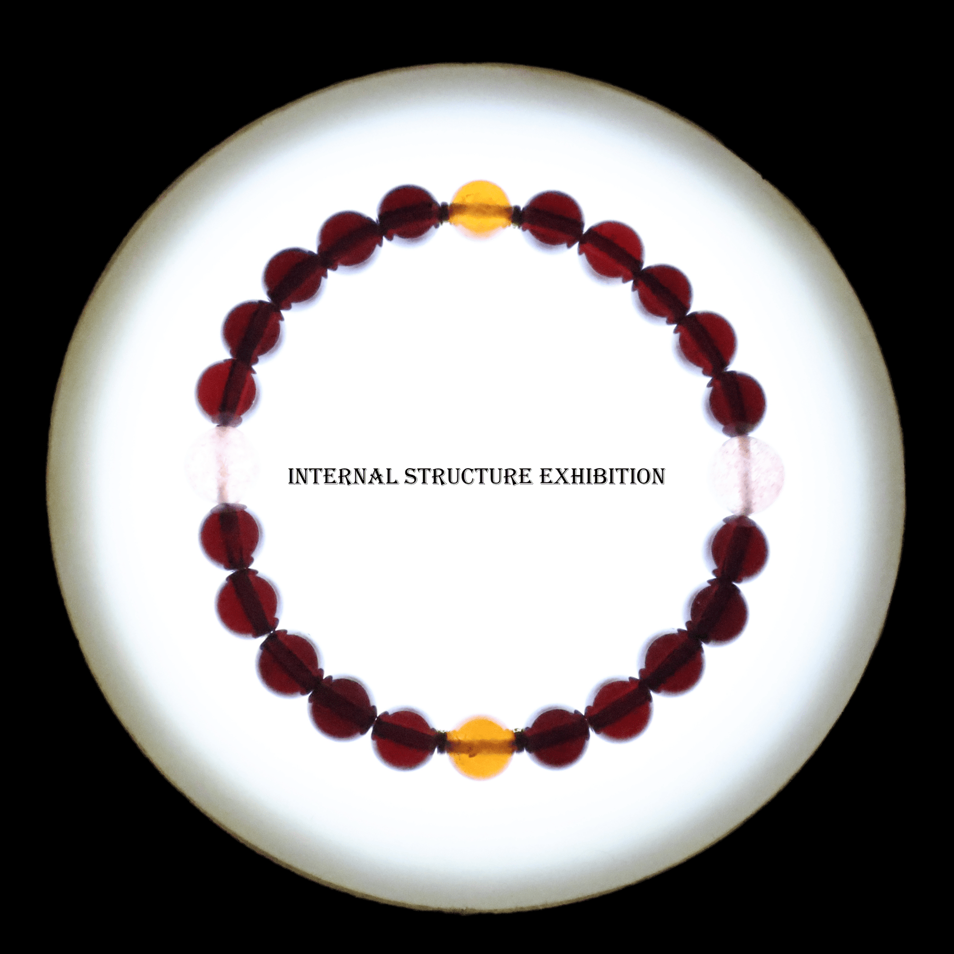 Red & Orange Garnet Bracelet I on white background, which shows internal structure